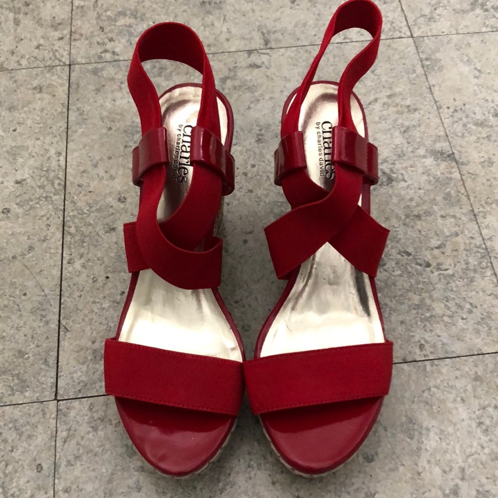 Red pair of espadrille wedges by Charles